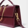 The large Bambino Cross-body metal flap bag