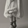 The long Bambino Long metal flap bag