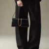 The long Bambino Long metal flap bag