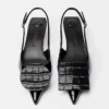 The low Duelo slingbacks Circle and square kitten heels