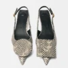 The low Duelo slingbacks Circle and square kitten heels