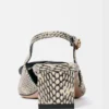 The low Duelo slingbacks Circle and square kitten heels