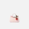 The strawberry Origami strawberry-shaped bag charm